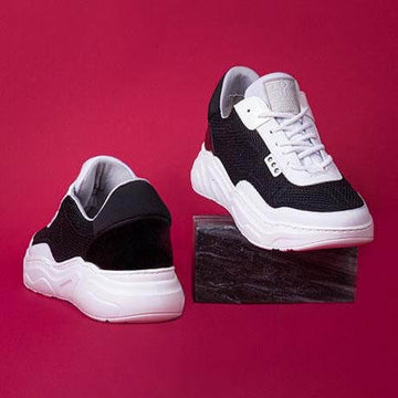Black and white recycled nylon DEBUT sneaker - A sporty, dynamic, and contemporary line: presenting our DEBUT sneaker. An ultra-flexible and lightweight white rubber sole, combined with black technical materials and white leather for energy and lightness.