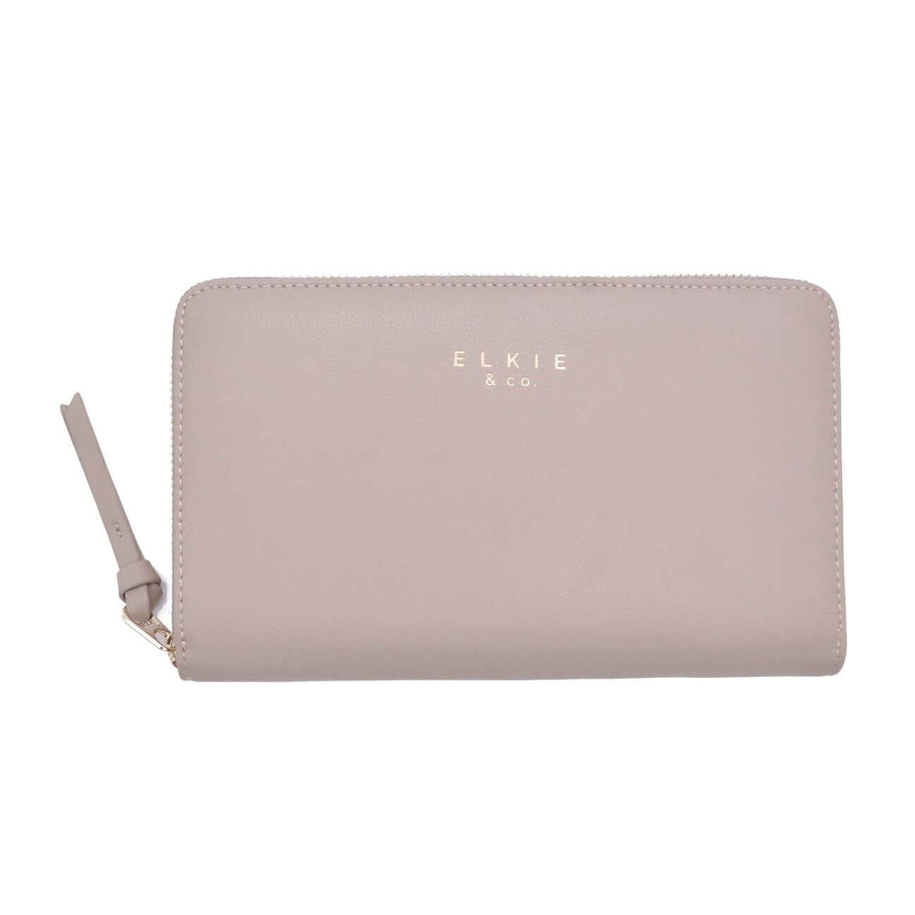 Elkie & Co. vegan leather wallet in beige, perfect for travel and daily use, crafted with attention to detail for style and functionality.